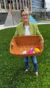 employee holding basket of eggs